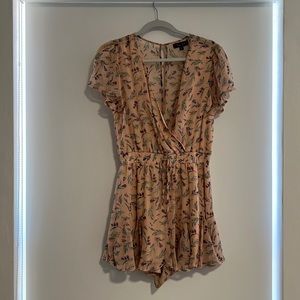 Floral Romper. Worn twice in great condition, like new. Size is Medium.